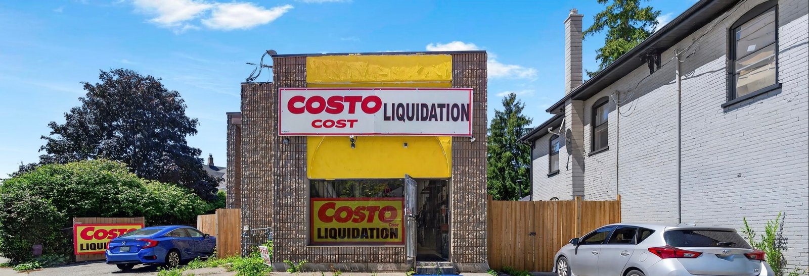 The Costo Cost Liquidation storefront in Cambridge, Ontario, with its yellow awning and signage
